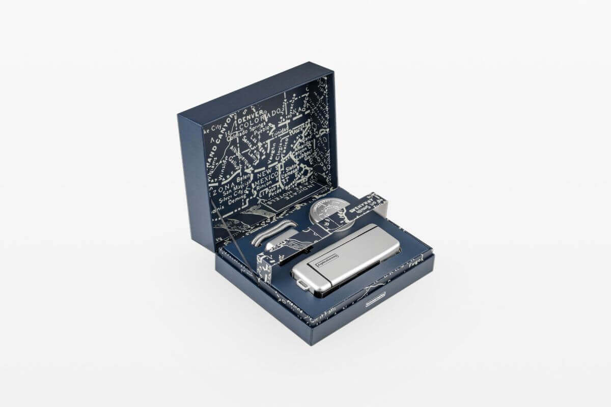 Lomography 110 Pocket Film Camera with Flash Metal Edition in elegant packaging showcasing its modern design.