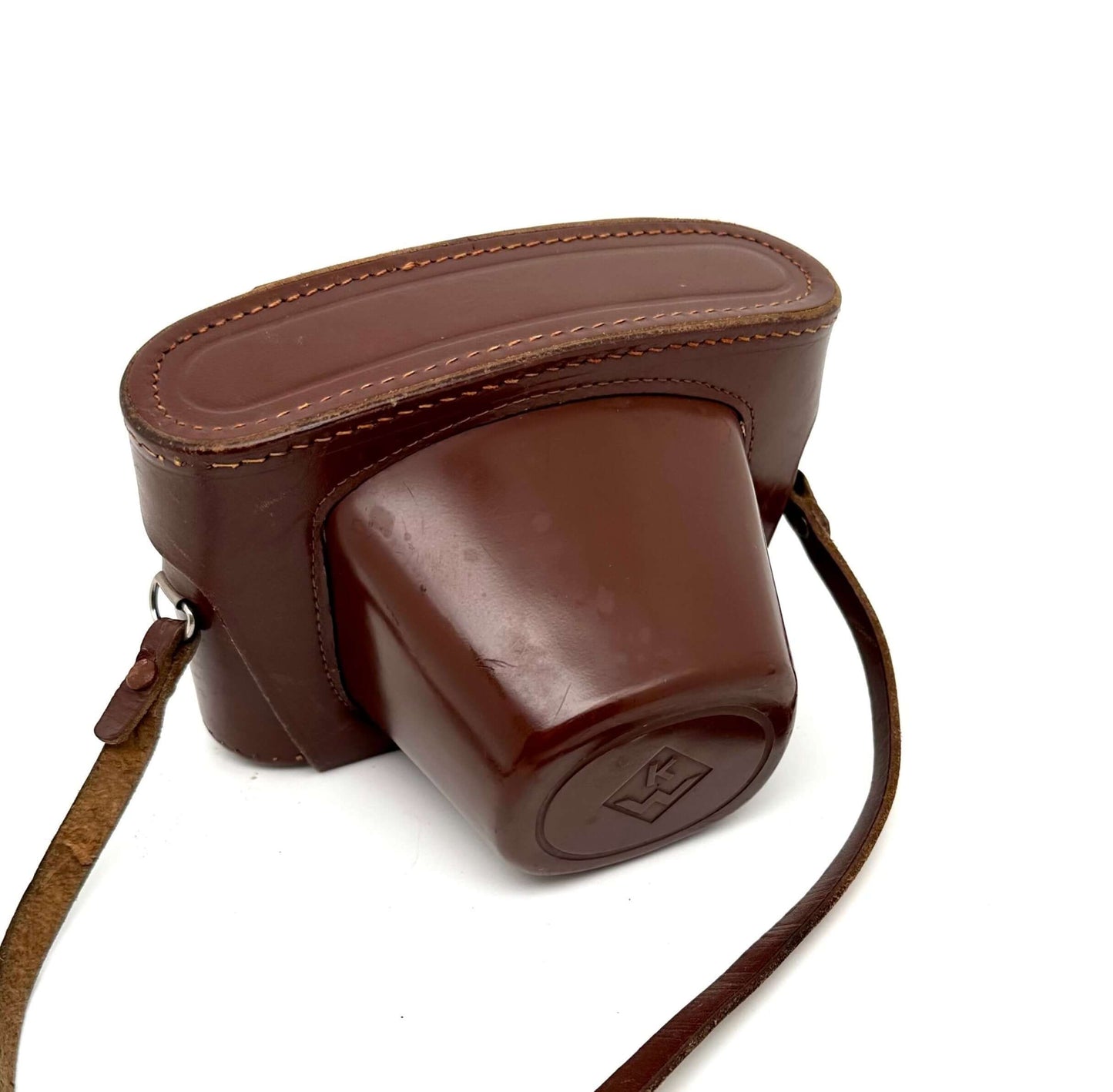 Brown leather camera case for Praktina FX with strap, vintage style, showing wear and tear.