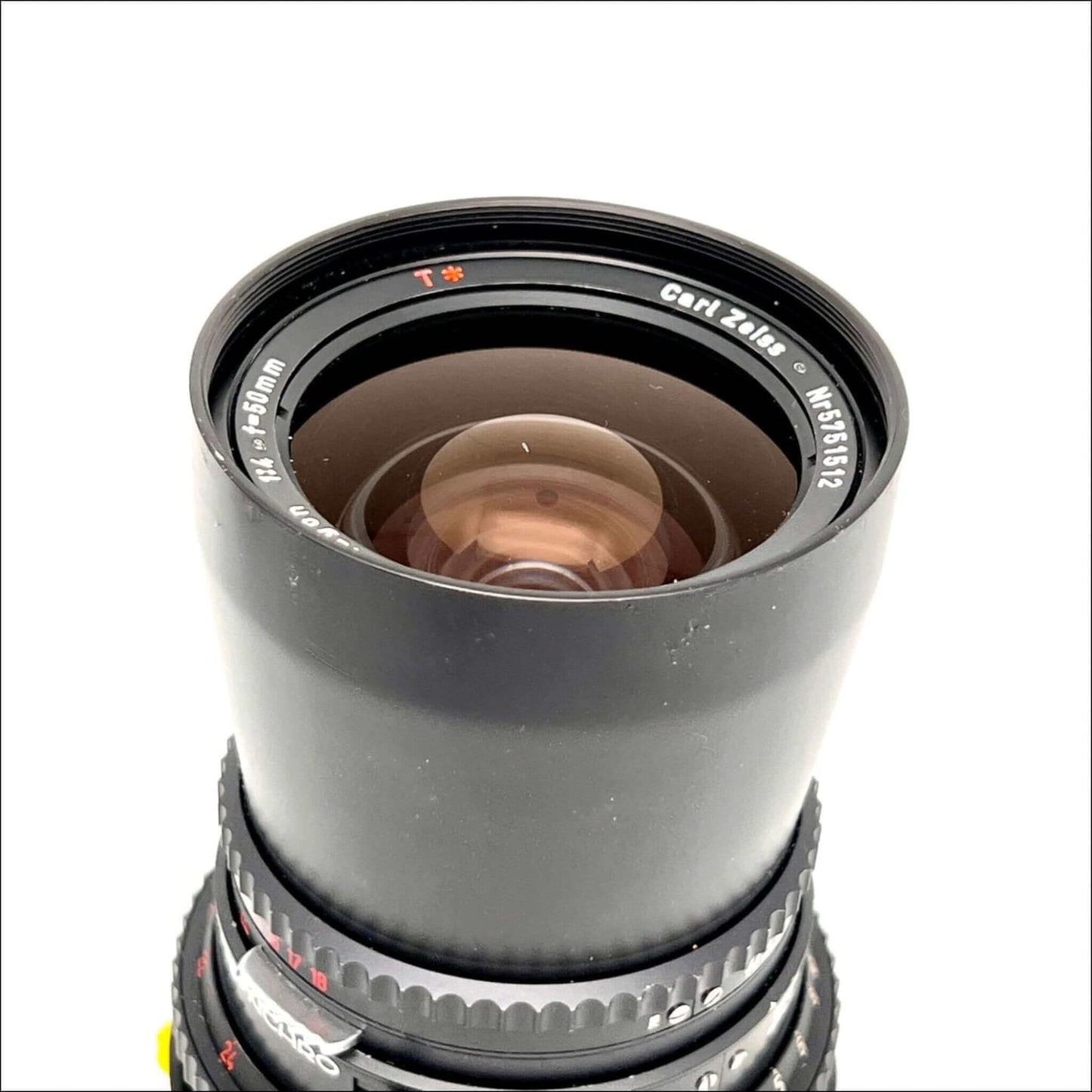 Top view of a used Hasselblad Carl Zeiss Distagon T* 50mm f4 lens showcasing the clean glass and focus ring.