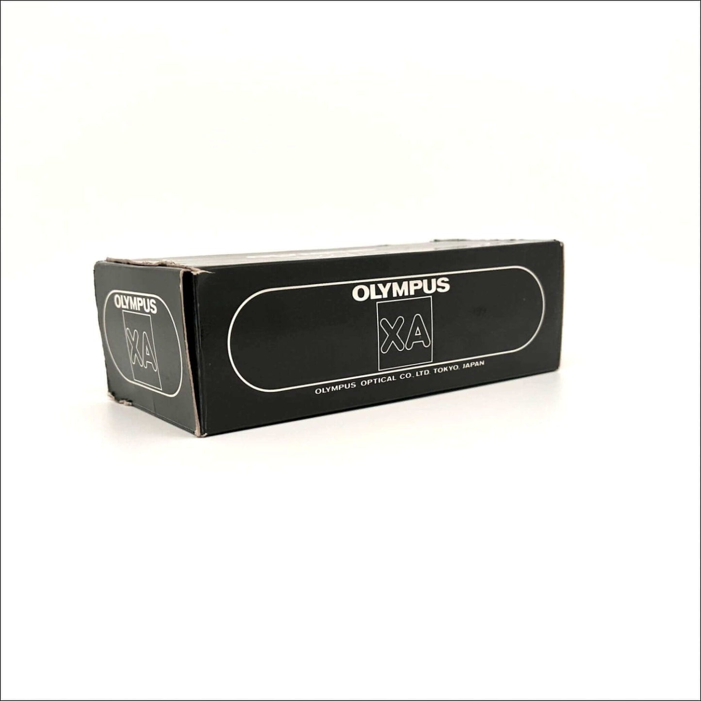 Olympus XA film camera box, vintage design, black packaging showcasing Olympus logo.