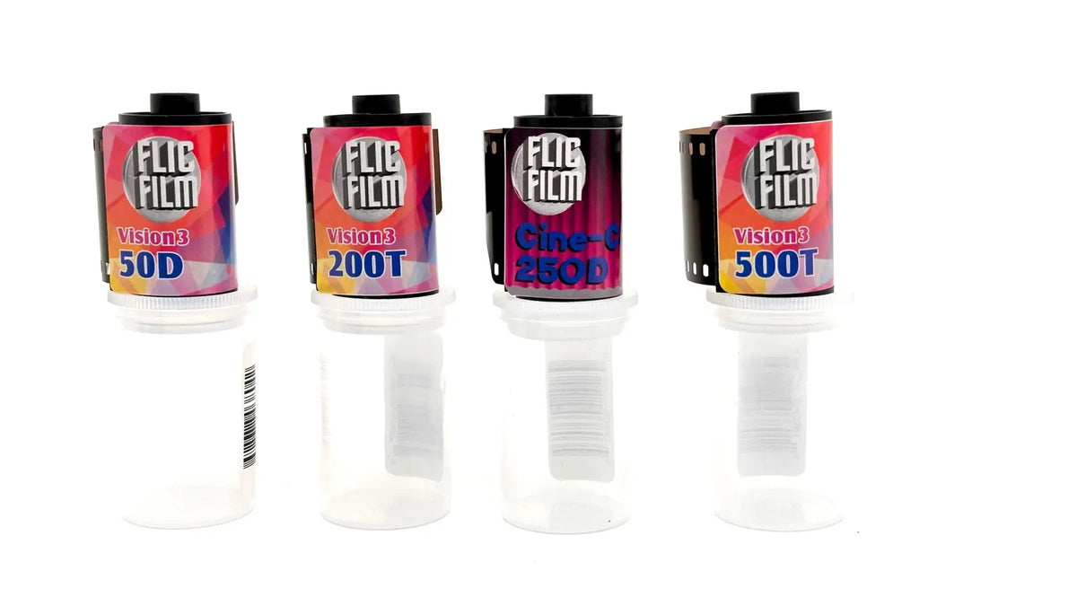 Four rolls of flig film instant film, each with a colorful label and black cap.