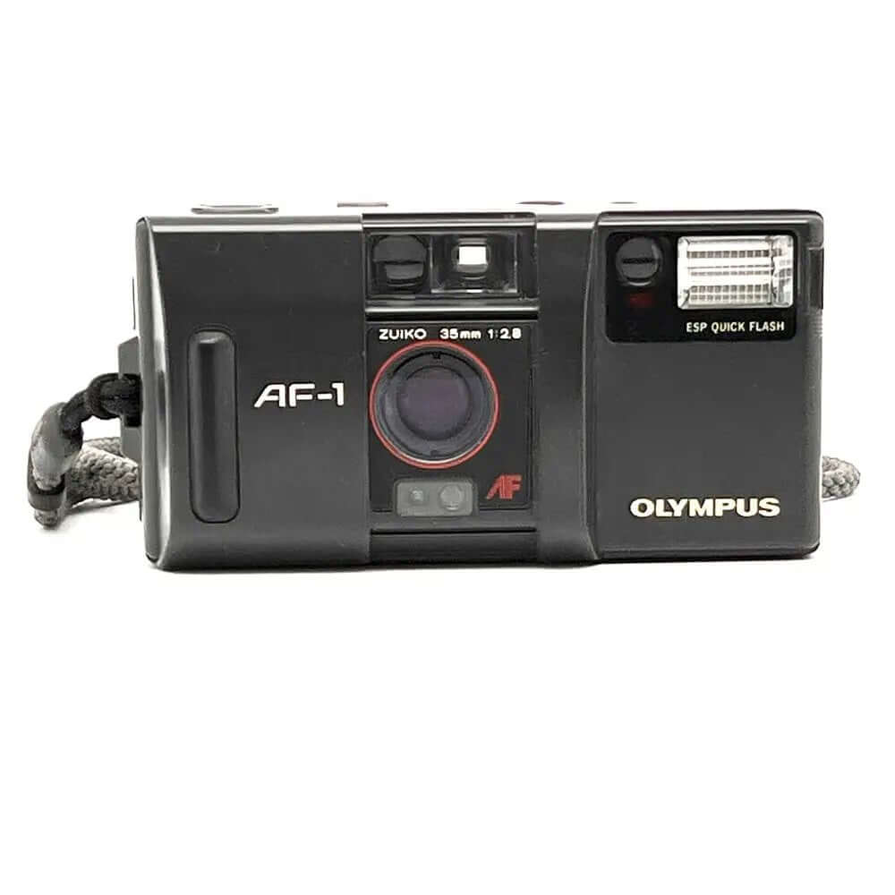 Black olympus af-1 compact camera with a red-ringed lens and built-in flash.