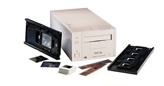 Beige plastic xerox 30c photocopier with black tray and film holders.