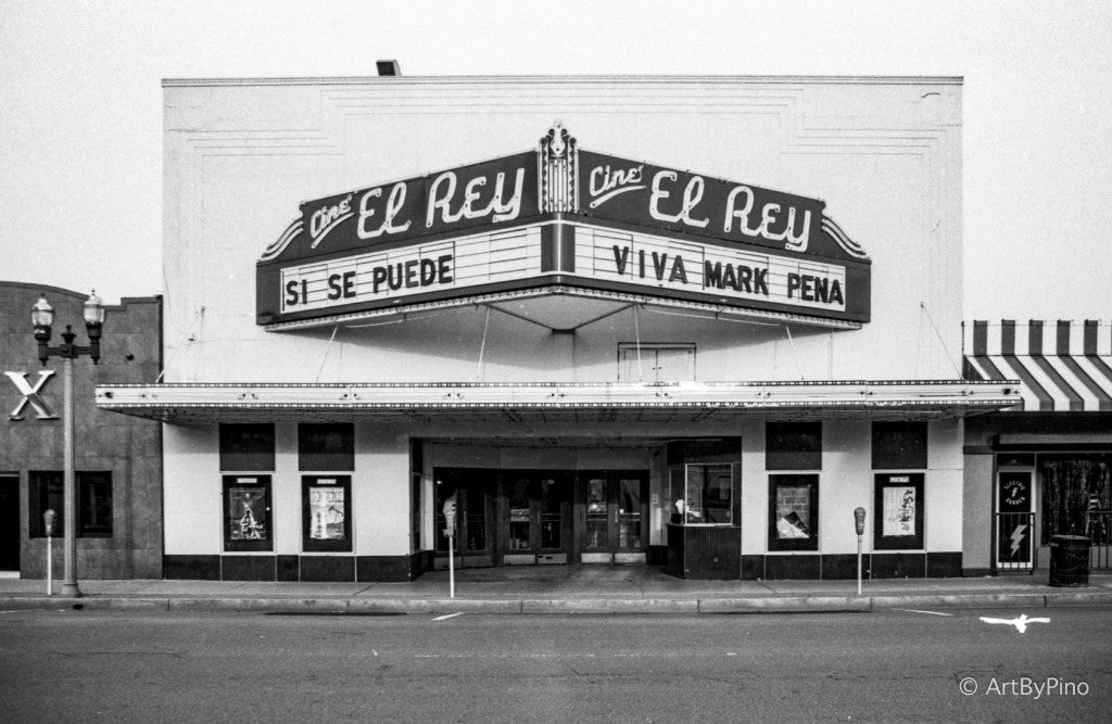 Cine El Rey Theatre corner marquee reading SI SE PUEDE and VIVA MARK PENA, McAllen — Ilford Ortho 80 35mm, Canon A2E