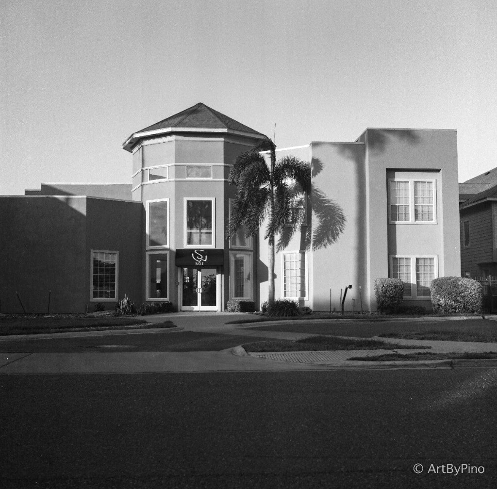 Stone Wood apartments entrance with SW 501 awning and palm-tree shadow, Stone Wood, McAllen — Ilford PanF+ 50 120, Yashica Mat 124