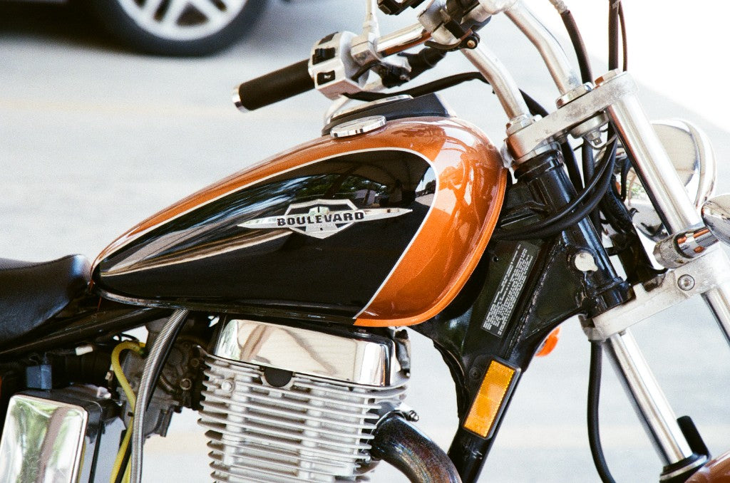 Suzuki Boulevard motorcycle tank (copper/black) shot on King Films Perutz 160 Color 35mm film, developed in Kodak C-41