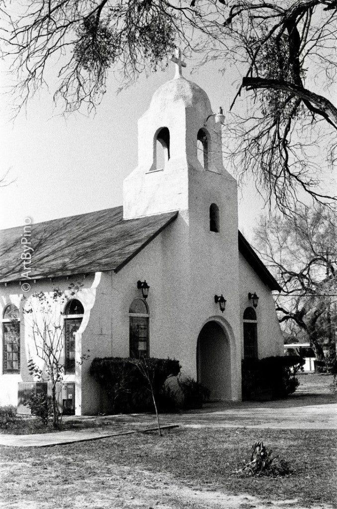 35mm + Lomography Berlin Kino B&W 400 — White mission-style bell tower and cross at St. Michael the Archangel Catholic Church, Los Ebanos, Texas