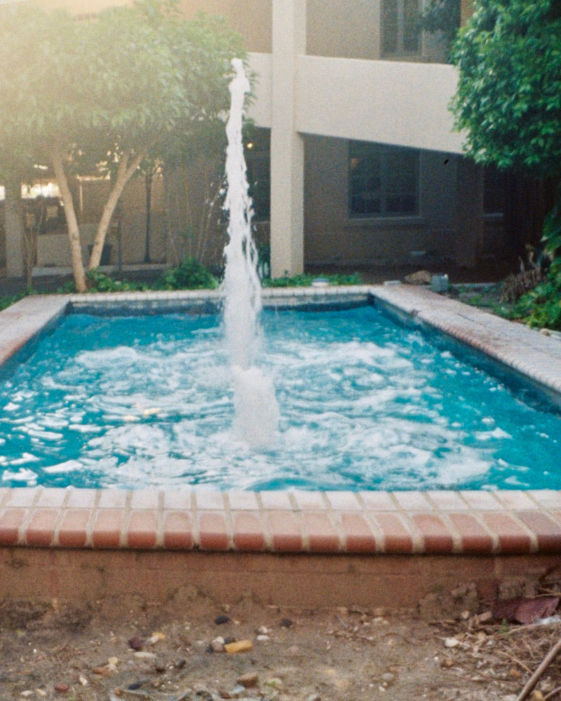 Fountain jet in a courtyard pool at Casa de Palmas, McAllen — Lomography Lomomatic 110 + Color Tiger 110 ISO 200 + 110