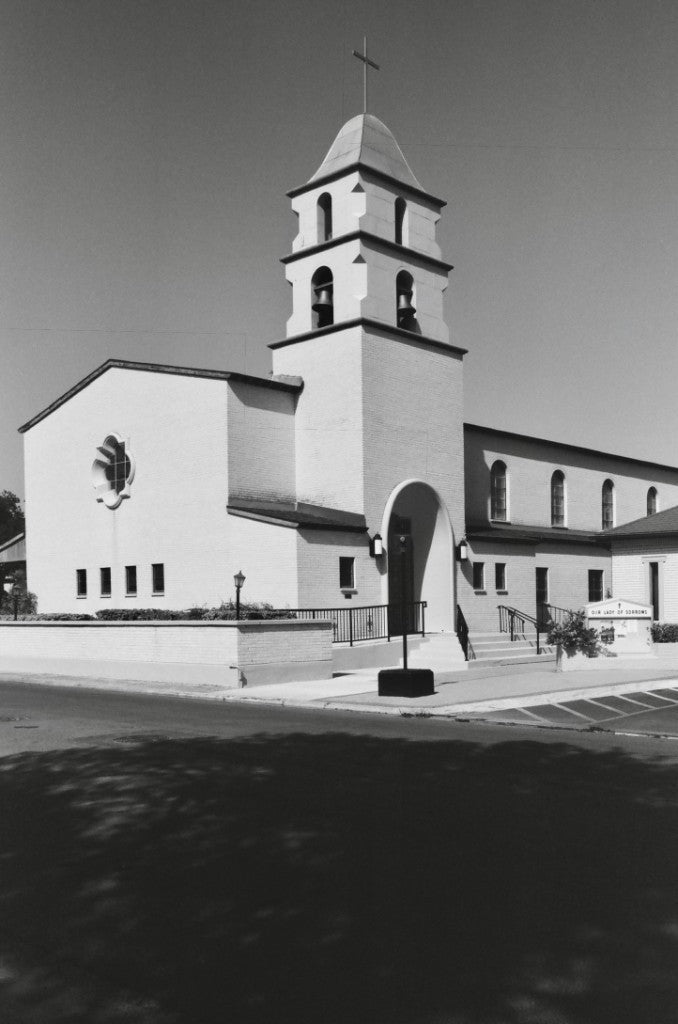Our Lady of Sorrows church facade and bell tower, shot on Reflx Lab Zarya 400 BW 35mm film, developed in D-76