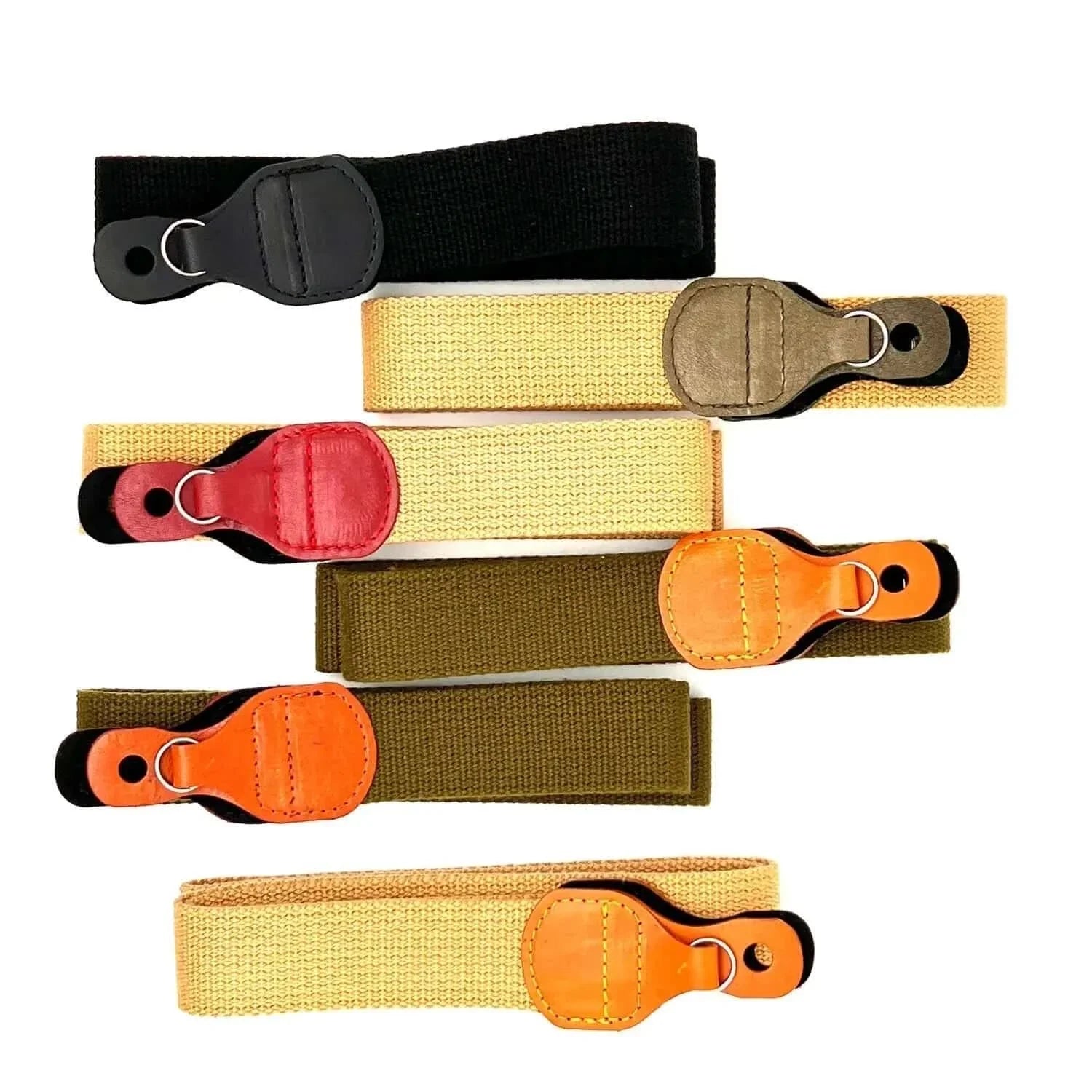 Five adjustable camera strap bands in black, beige, red, olive green, and orange with leather-like end pieces.