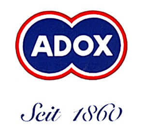 The classic blue and red adox logo with ’seit 1860’’ written beneath it.