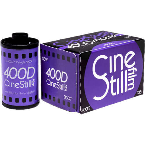 Purple cinestill 400d film canister and box, featuring bold white lettering on a vibrant purple background.