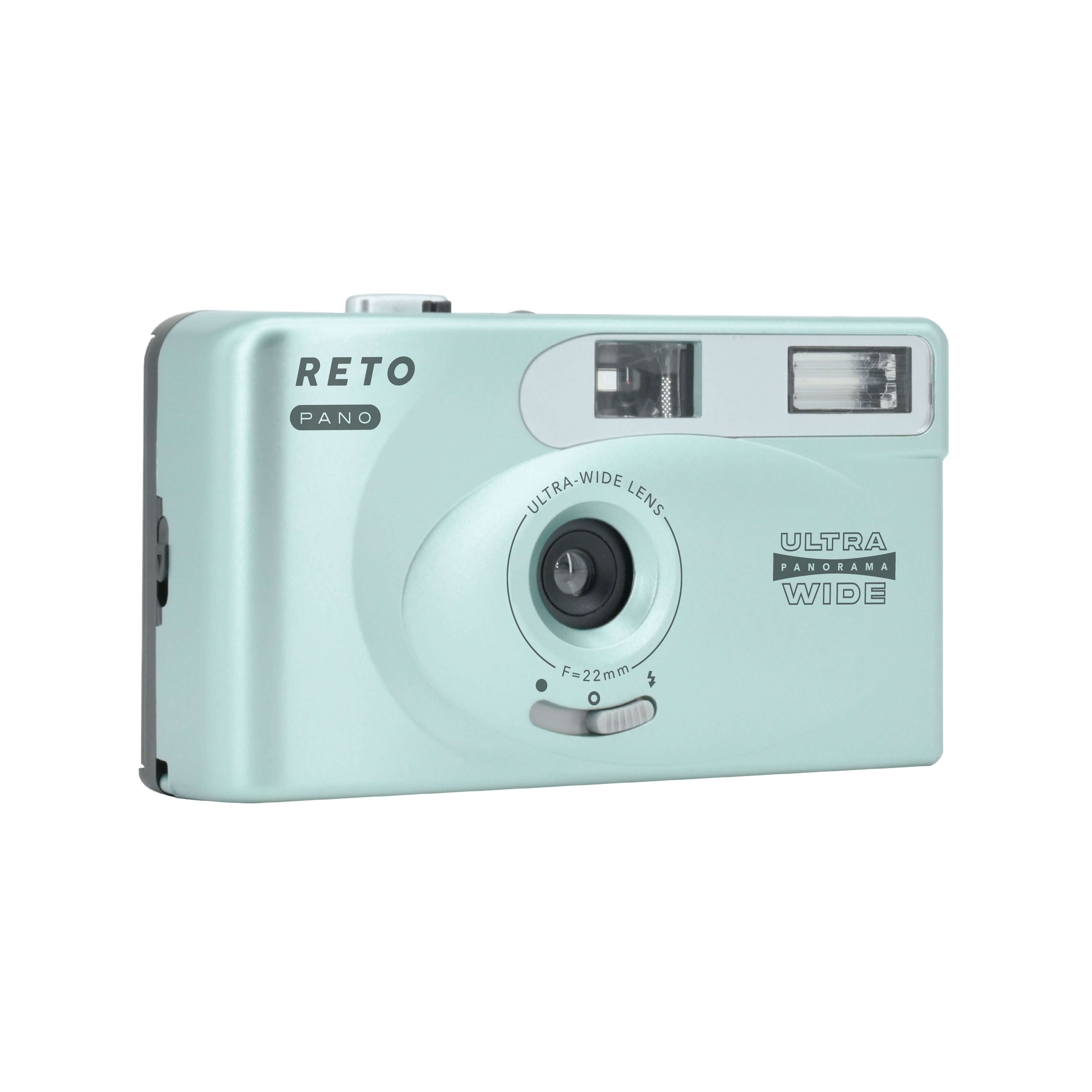 Mint green plastic compact camera with silver accents and ’reto pano’ branding.
