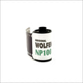 Original wolfen np100 film roll with a white label and green text, featuring black perforated edges.