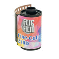 A vibrant, geometrically patterned roll of fujifilm cine-color 250d film with a black plastic spool and perforated edge.