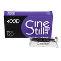 Purple and black cinestill 400d film pack with a silver-wrapped roll of 120mm color negative film.