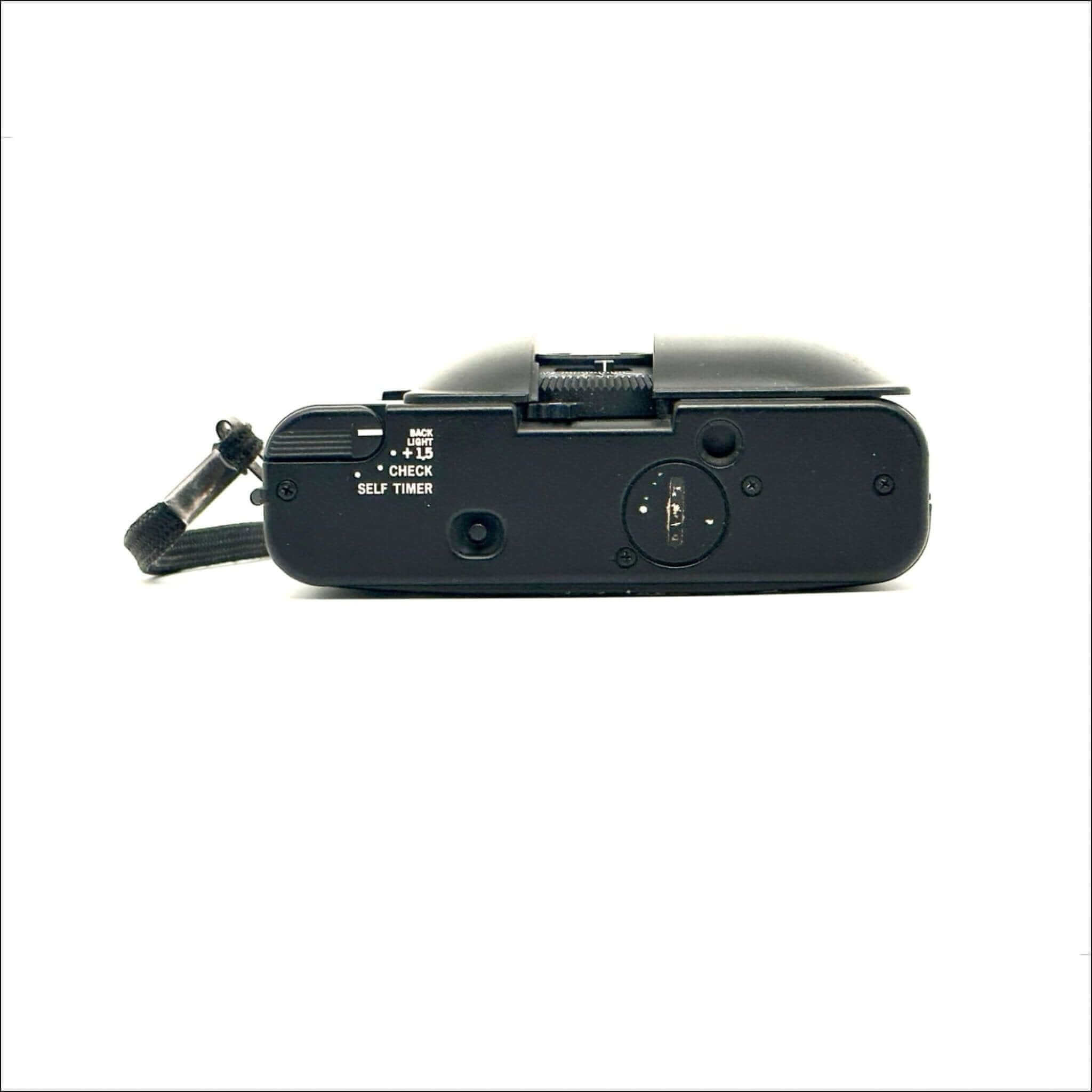 Black compact digital camera with a textured grip and visible control buttons.