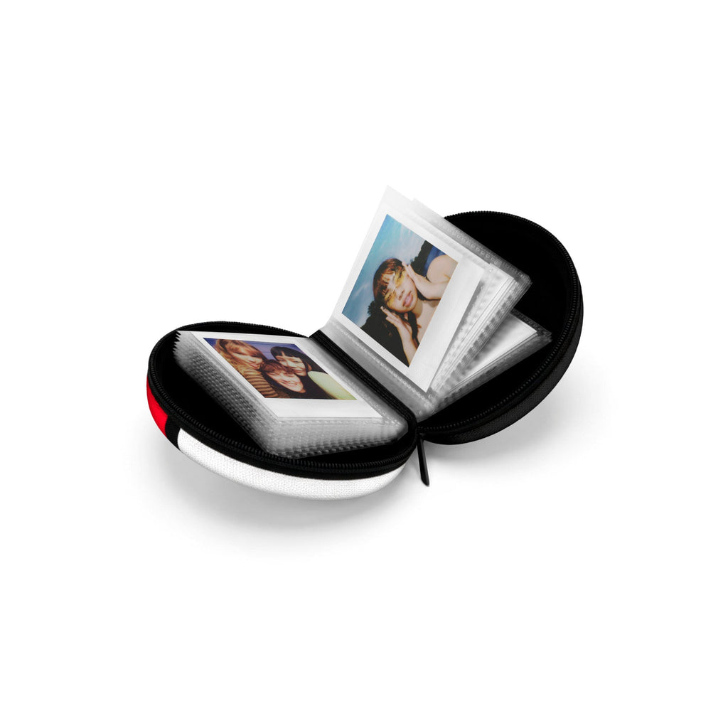 Polaroid Go Poké Ball photo album opened flat showing photo sleeves