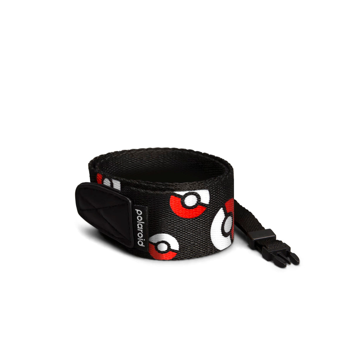 Coiled Polaroid Pokémon Edition flat camera strap showing the Poké Ball pattern