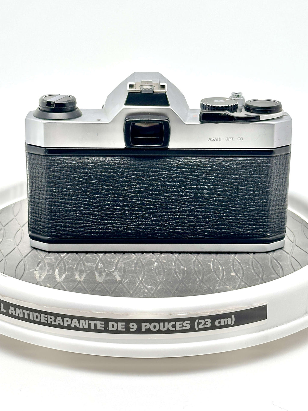 Silver and black asahi pentax 6x7 film camera with textured leather grip.