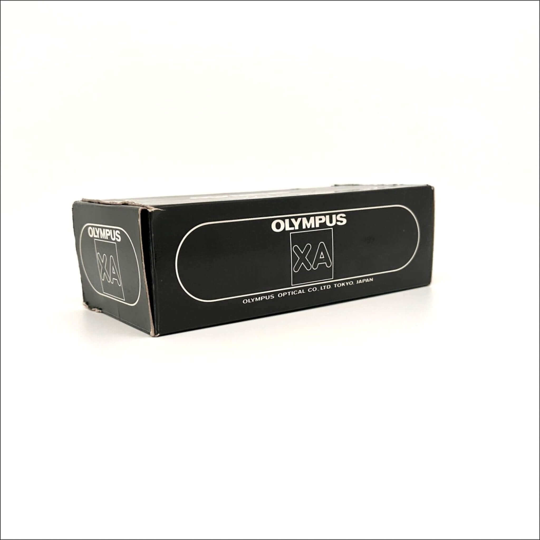Black rectangular box with white ’olympus xa’ branding and text indicating olympus optical co.
