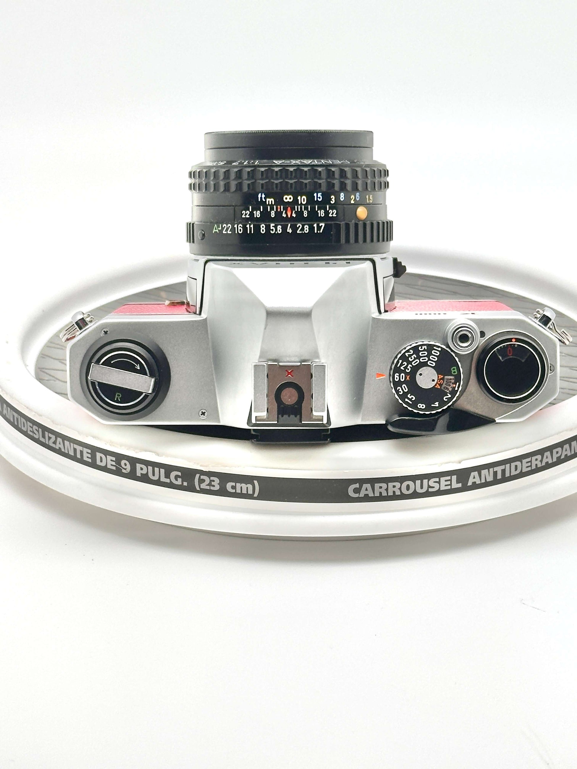 Japanese Asahi Pentax K1000 35mm film camera top view with 50mm f1.7 lens, showcasing classic design and features.