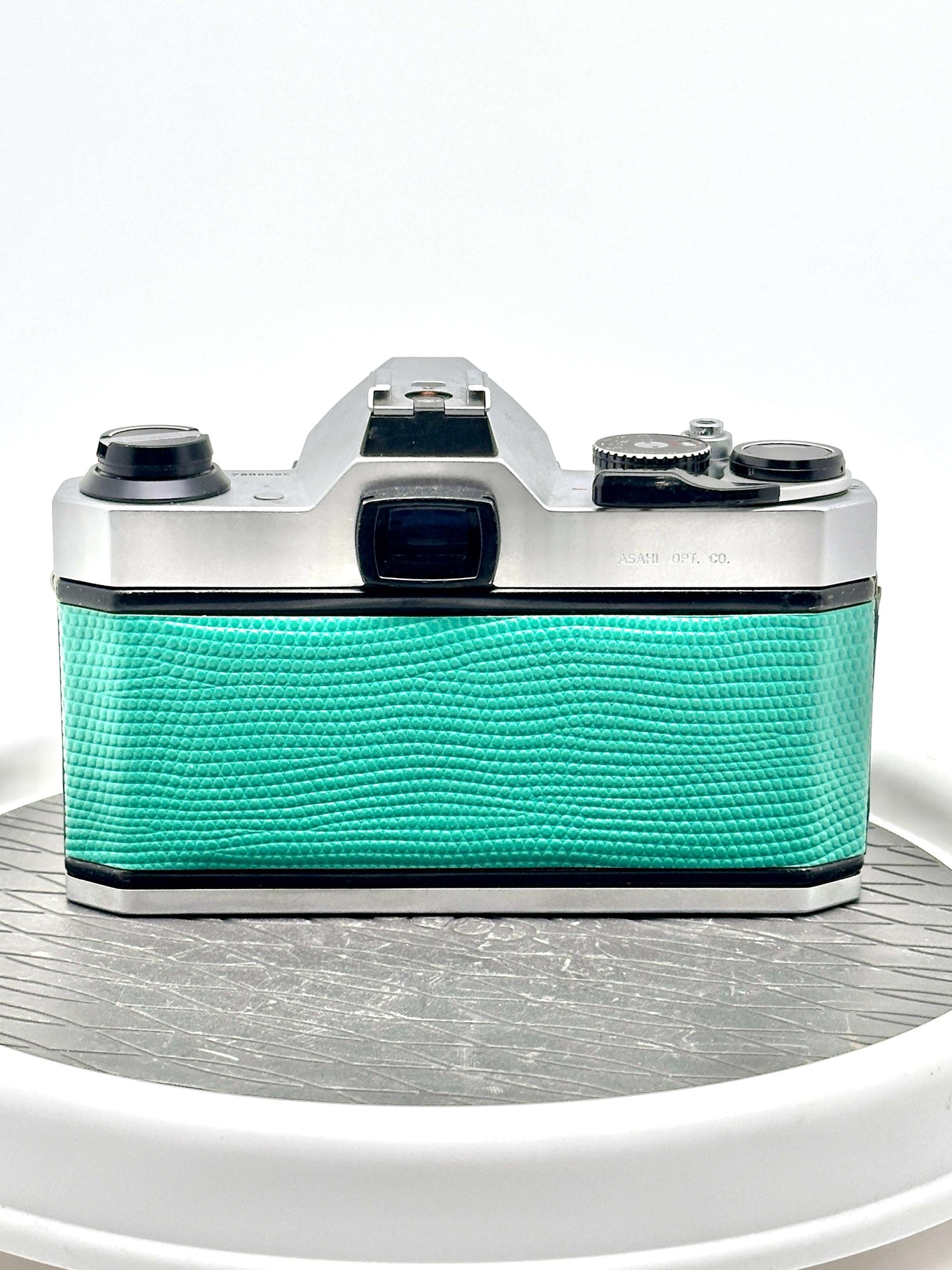 Back view of Japanese Asahi Pentax K1000 teal used 35mm film camera, showcasing its vintage design and build quality.