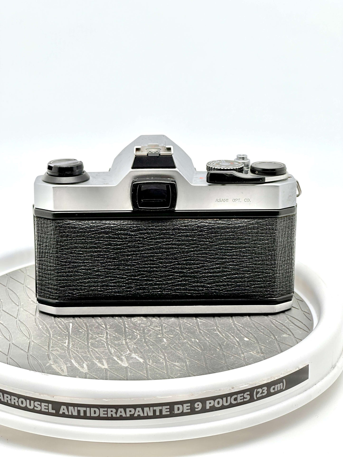 Back view of a Japanese Asahi Pentax K1000 black used 35mm film camera showcasing its sleek design.