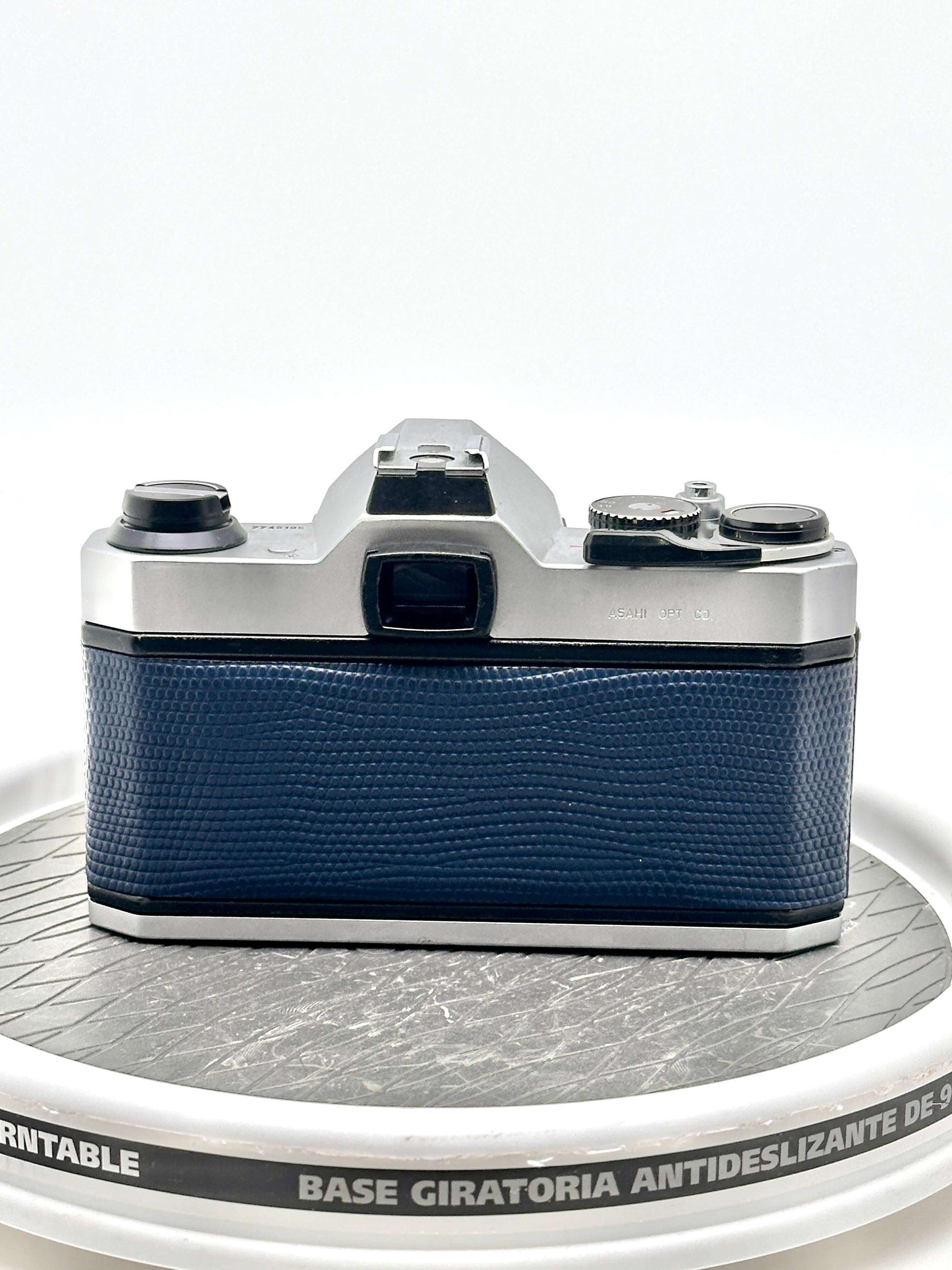 Japanese Asahi Pentax K1000 used 35mm film camera with blue textured finish on body.