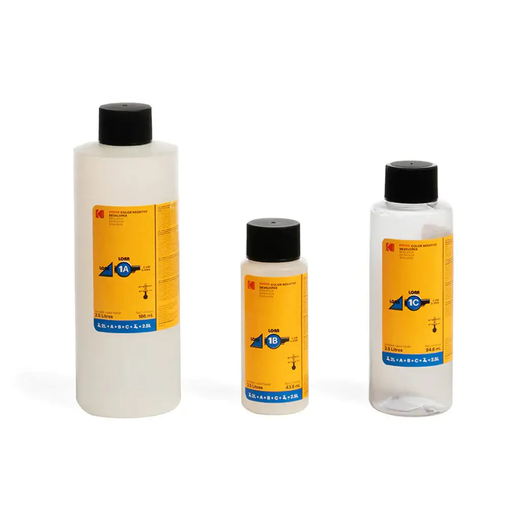 Three bottles of Lok 3D adhesive, labeled 1A, 1B, and 1C, in various sizes with yellow labels and black caps.