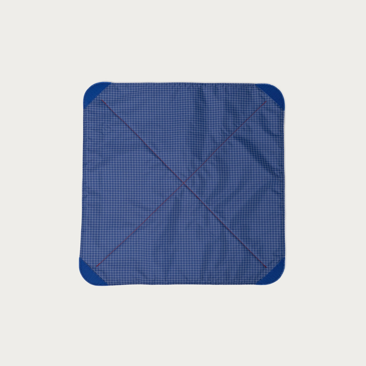Blue grid nylon ripstop interior of the Long Weekend padded camera wrap with blue velcro corner tabs