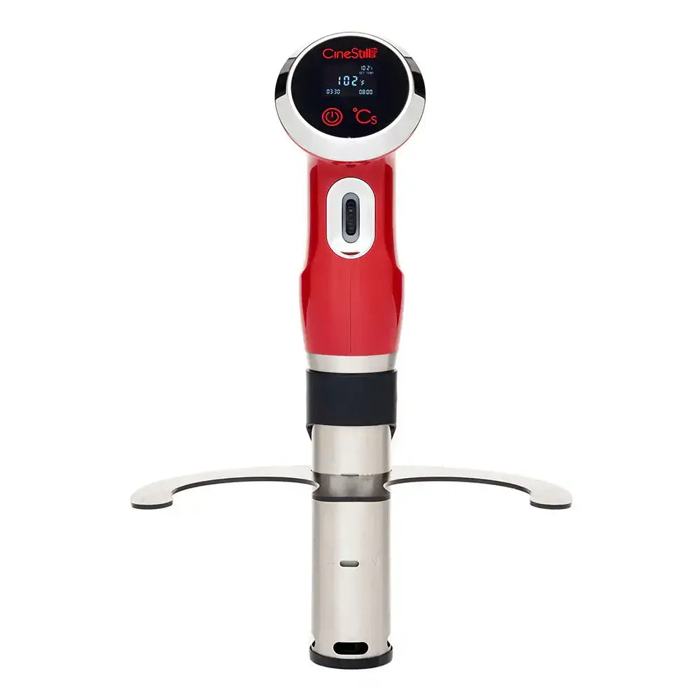 Red and silver immersion circulator for sous vide cooking with digital display.