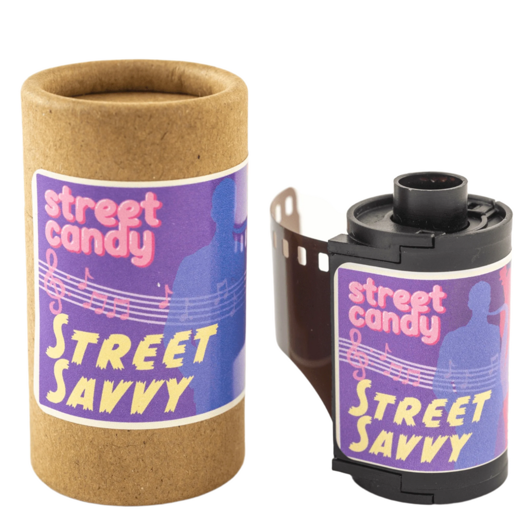 Purple and pink ’street savvy’ branded film roll with musical notes design, housed in a brown cardboard tube.