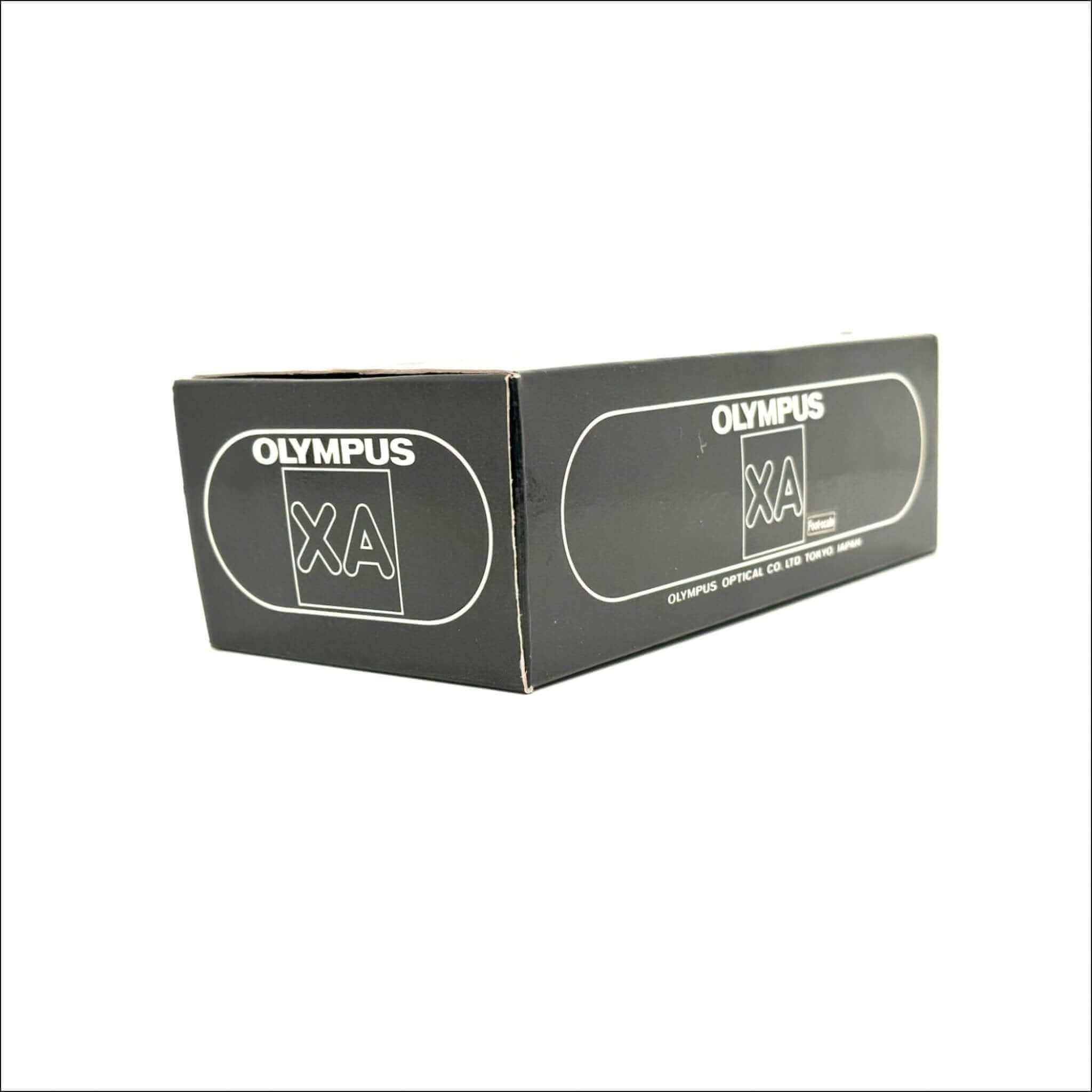 Black rectangular box with white ’olympus xa’ branding and a small logo, featuring the text ’olympus optical co., ltd.