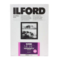 Ilford mgrc multigrade rc deluxe glossy photographic paper, 12.7 x 17.8 cm (5x7 in), featuring a sleek white packaging with bold black and vibrant pink accents for the new edition label