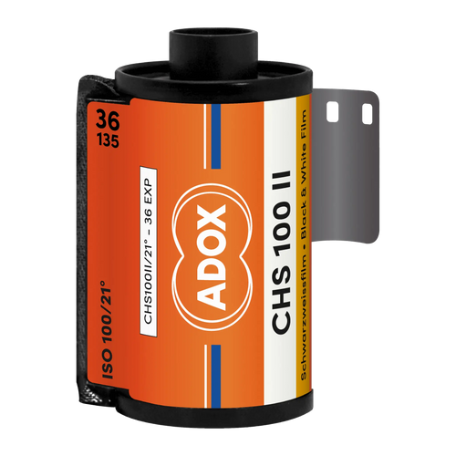 Orange and white labeled adox chs 100 ii black-and-white film roll with a black plastic spool.