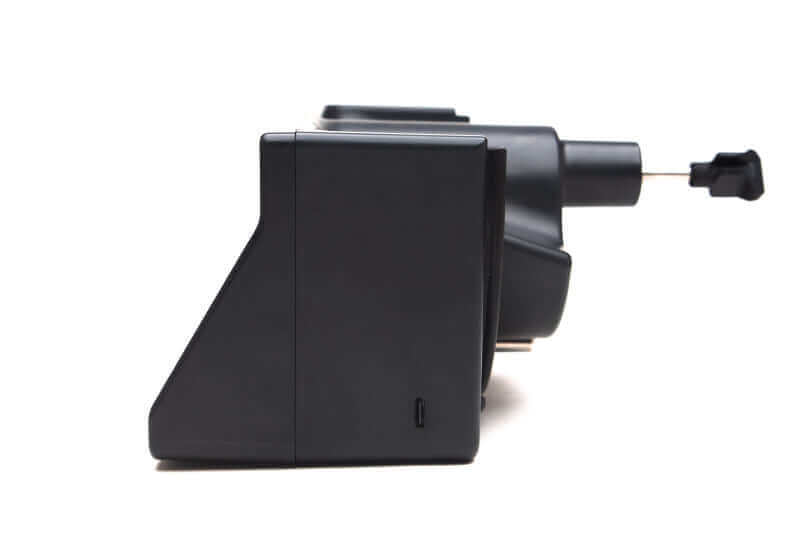 Side view of a black electronic device with a protruding connector.