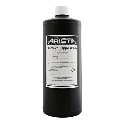 Black plastic bottle with white cap and label reading ’premium arista archival hypo wash.’