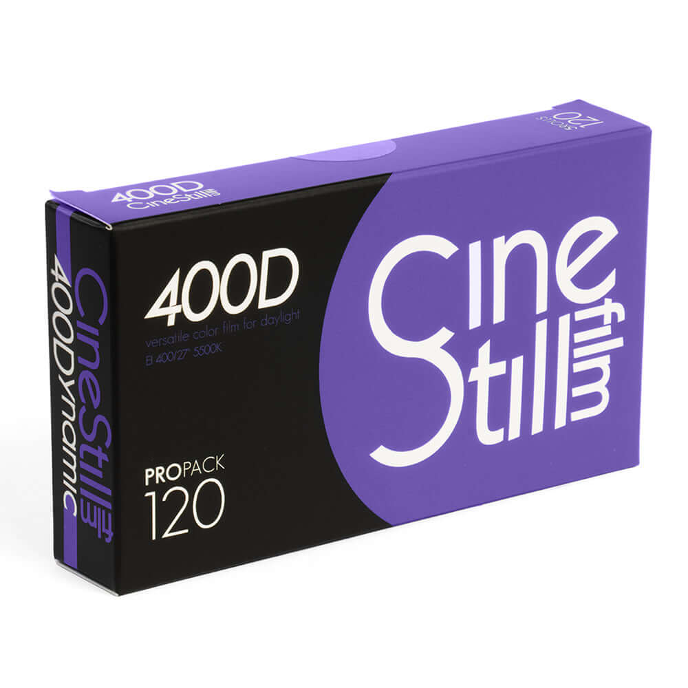 Purple and black box of cinestill 400d color film for daylight, labeled as a propack 120.