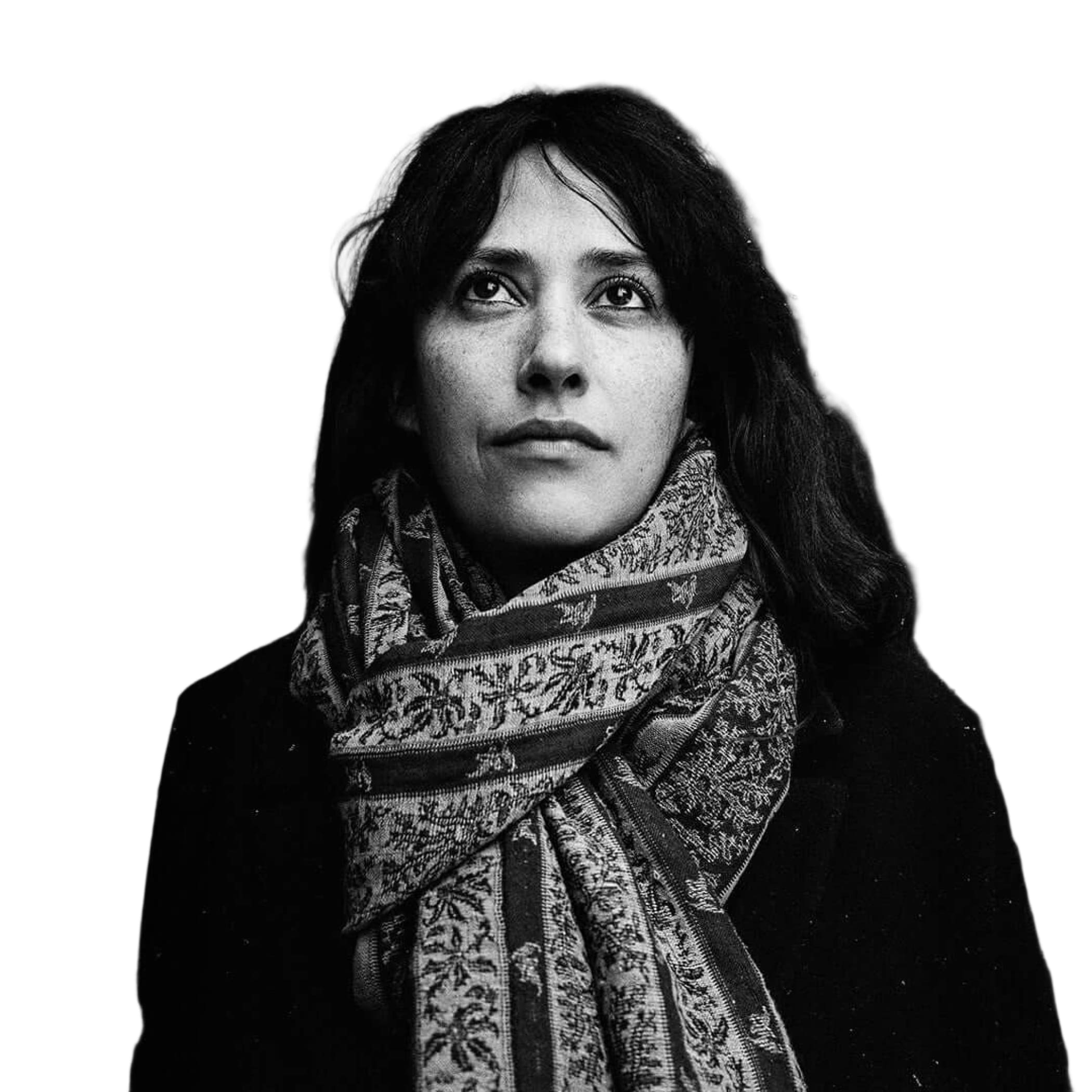 A patterned scarf with intricate floral and geometric designs, wrapped around the neck.