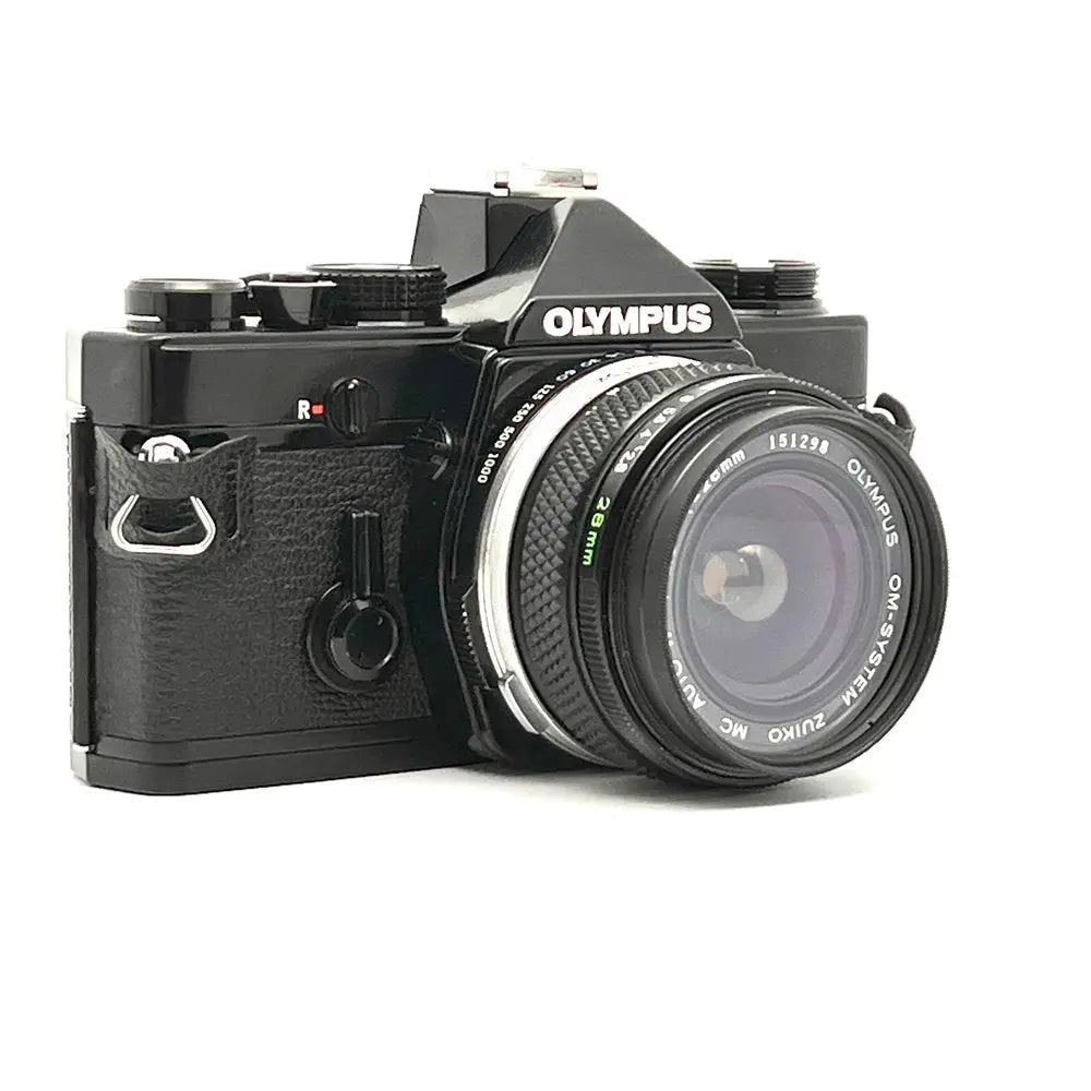 Black Olympus OM-10 film camera with leather grip and silver lens