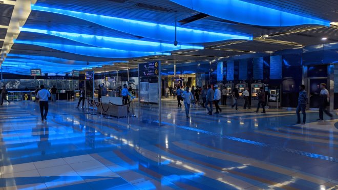 Modern blue wavy ceiling in Dubai Metro station with embedded lights