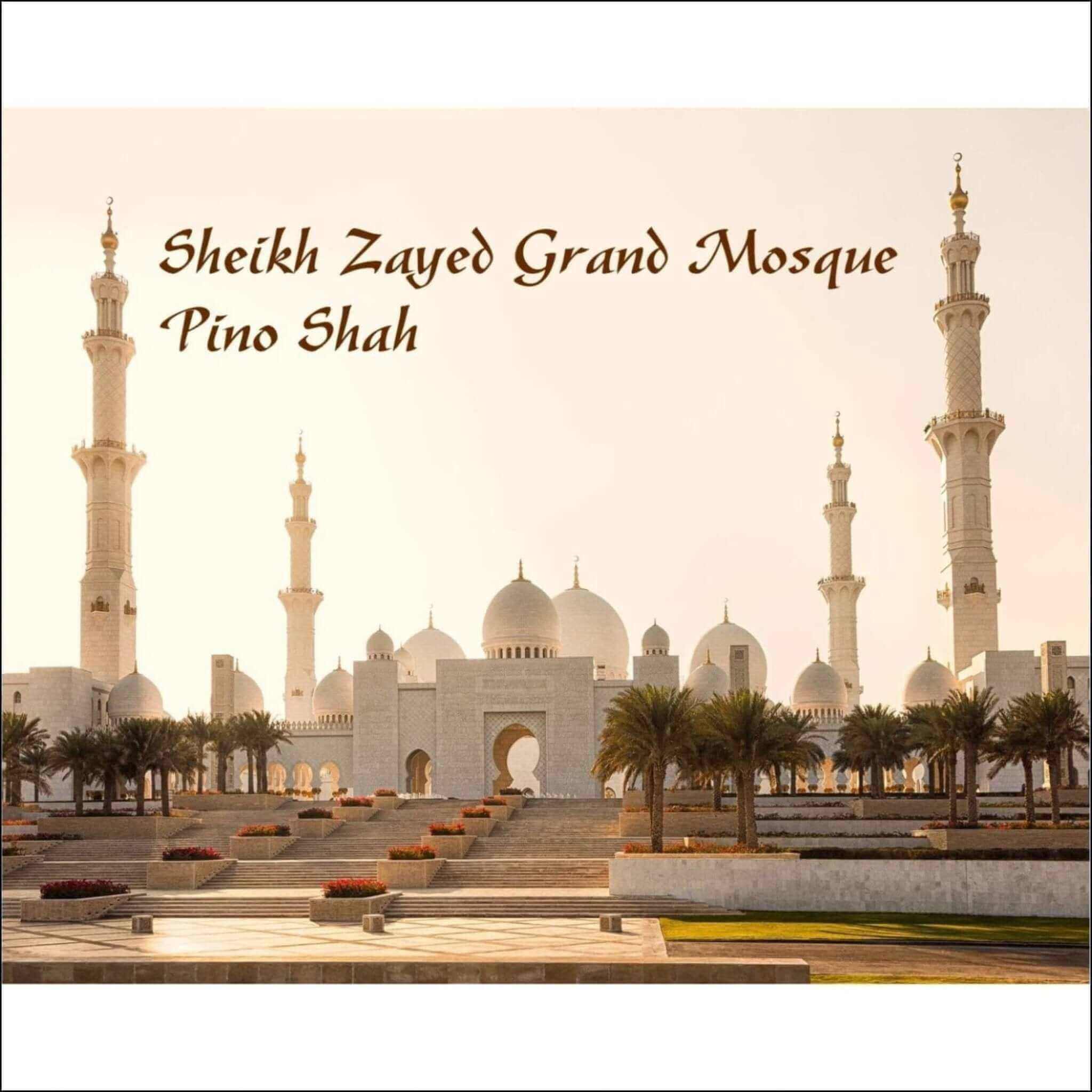 The sheikh zayed grand mosque, a majestic white marble structure with multiple domes and towering minarets.