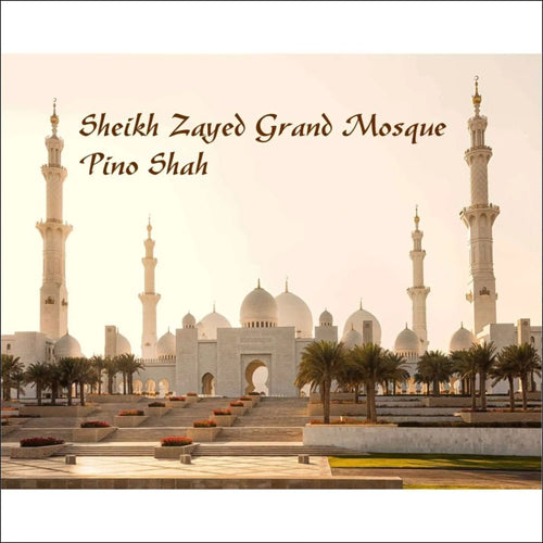 The sheikh zayed grand mosque, a majestic white marble structure with multiple domes and towering minarets.