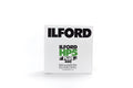 White rectangular box of ilford hp5 plus 400 black and white film, featuring bold black and green branding.
