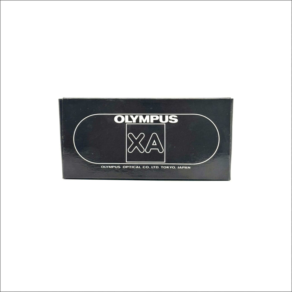 Black rectangular box for an olympus xa camera, featuring white branding and a sleek minimalist design.