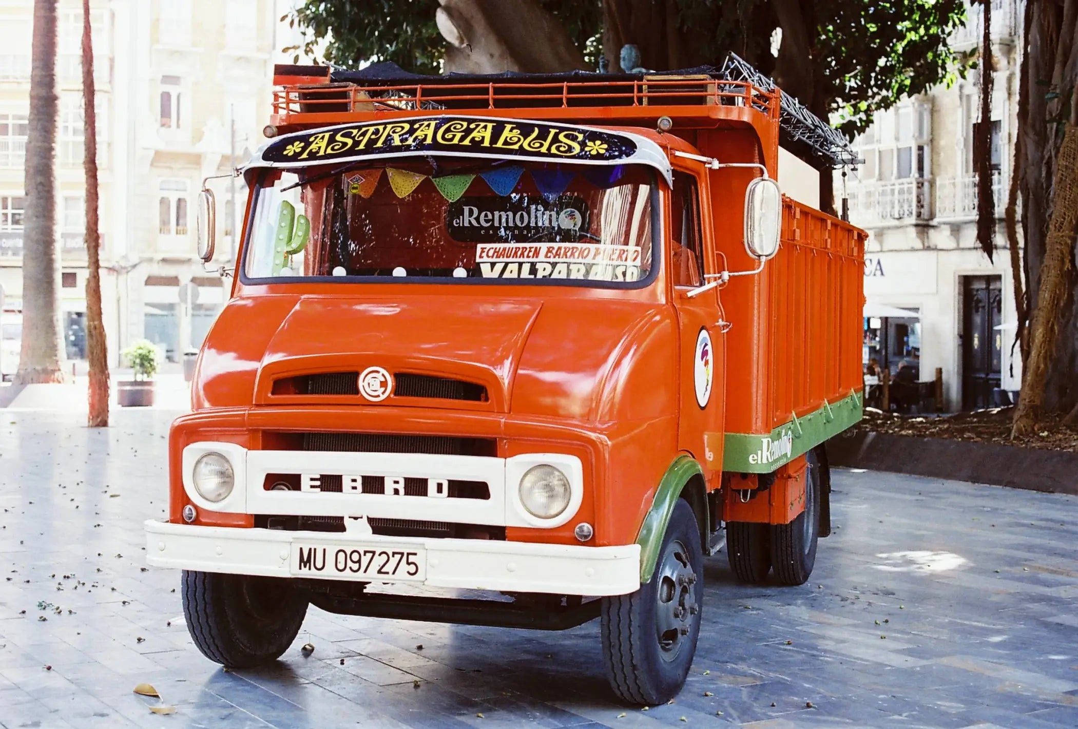 Vintage orange and green fuso truck with white bumper on candido c41 color 200 iso 35mm color negative film exp 04/2028