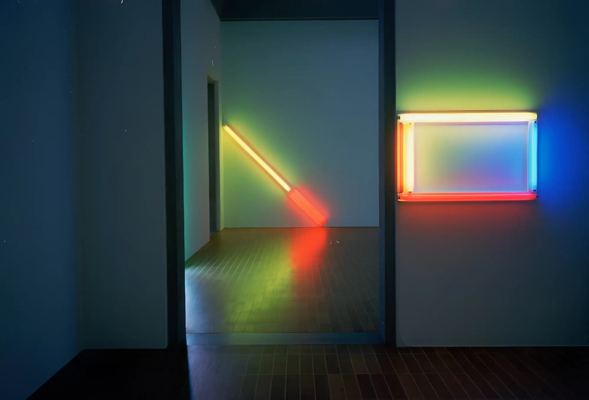 A rectangular neon light fixture with vibrant orange to blue rainbow colors featured with candido c41 35mm color negative film