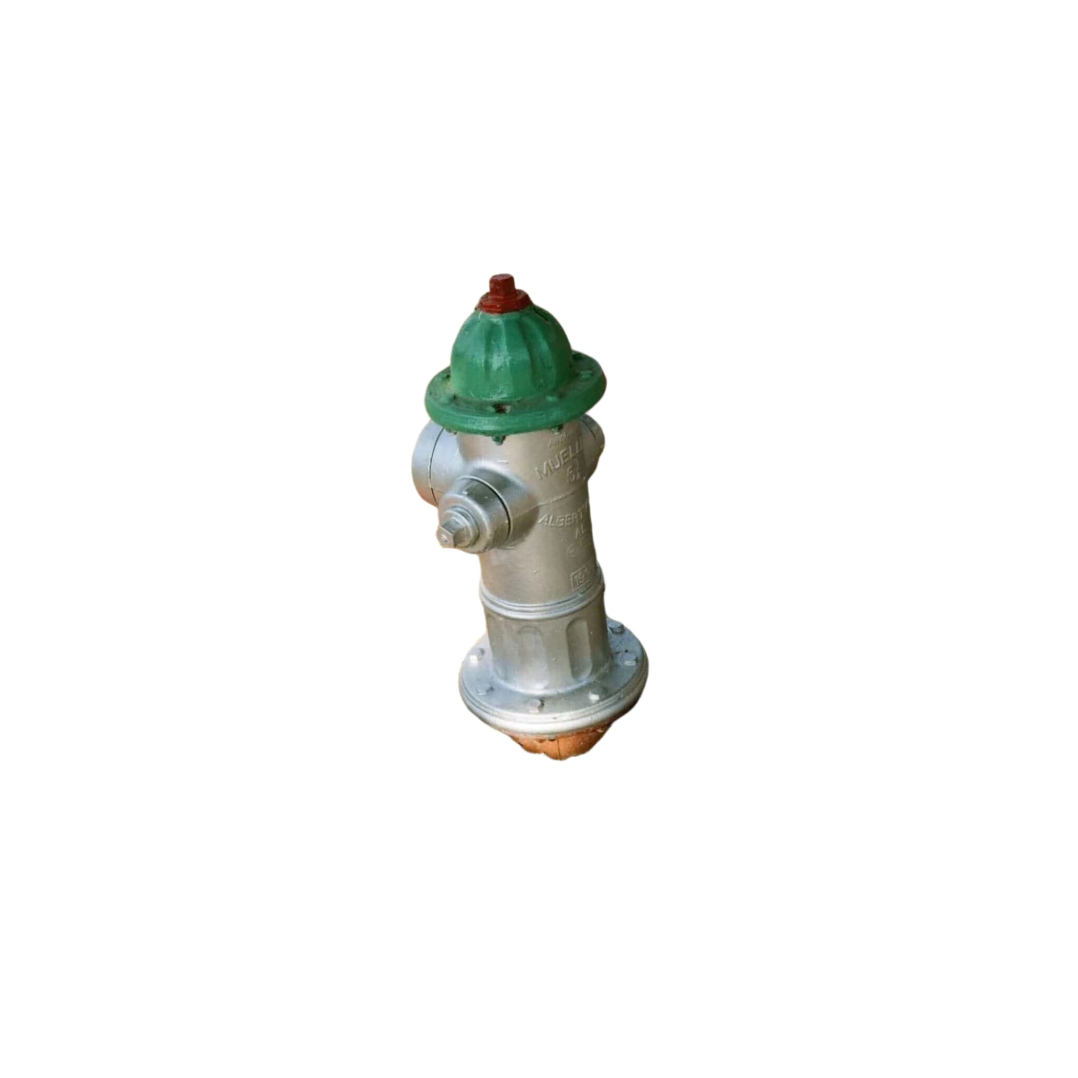 A silver fire hydrant with a green top and red cap, set in a gravel bed beside a sidewalk.
