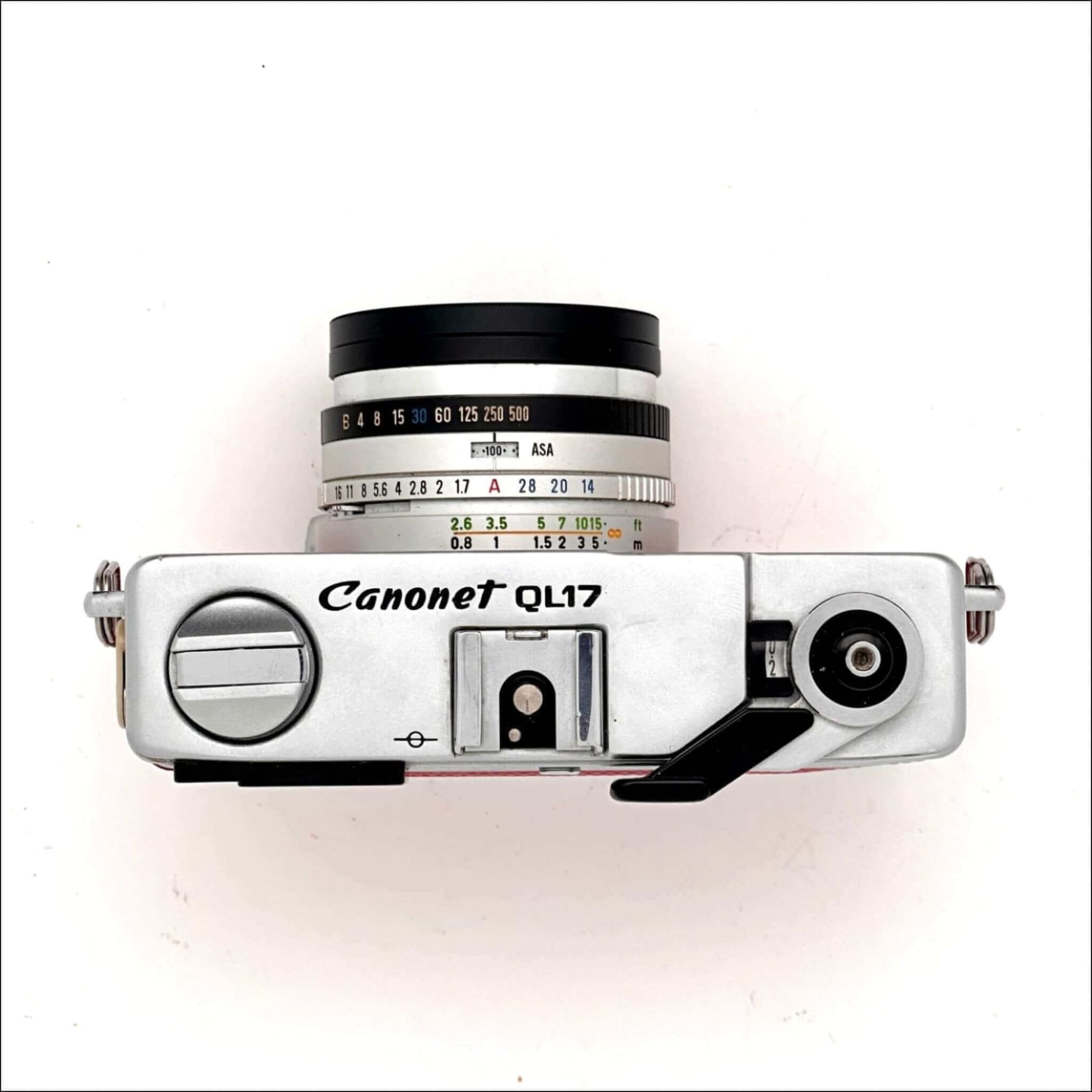Silver canonet ql17 film camera with a black lens and white engraved markings.